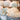 Close up of raw craft wool in a metal bucket