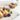 Various fruits drying on a wool dish drying mat in the sun