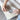 Hands putting a cover over a wool ironing board pad