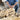 American wool processing demonstration showing sustainable wool fiber preparation for premium natural bedding and home goods made from domestically-sourced wool