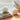 Close up of two wool dryer balls amongst linens