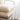 close up of two wool pillows stacked on top of each other on a wooden chair