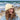 A wool watch cap being worn by a woman on the beach