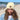 A wool beanie being worn by a woman at the beach