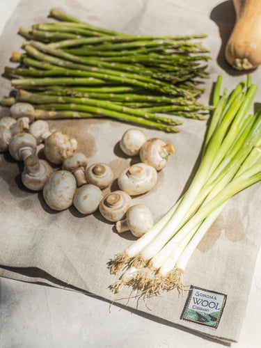 Sonoma Wool Company's Wool Dish Drying Mat with vegetables drying on it.