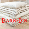 Wool bedding stacked with red Barn Bin lettering over top